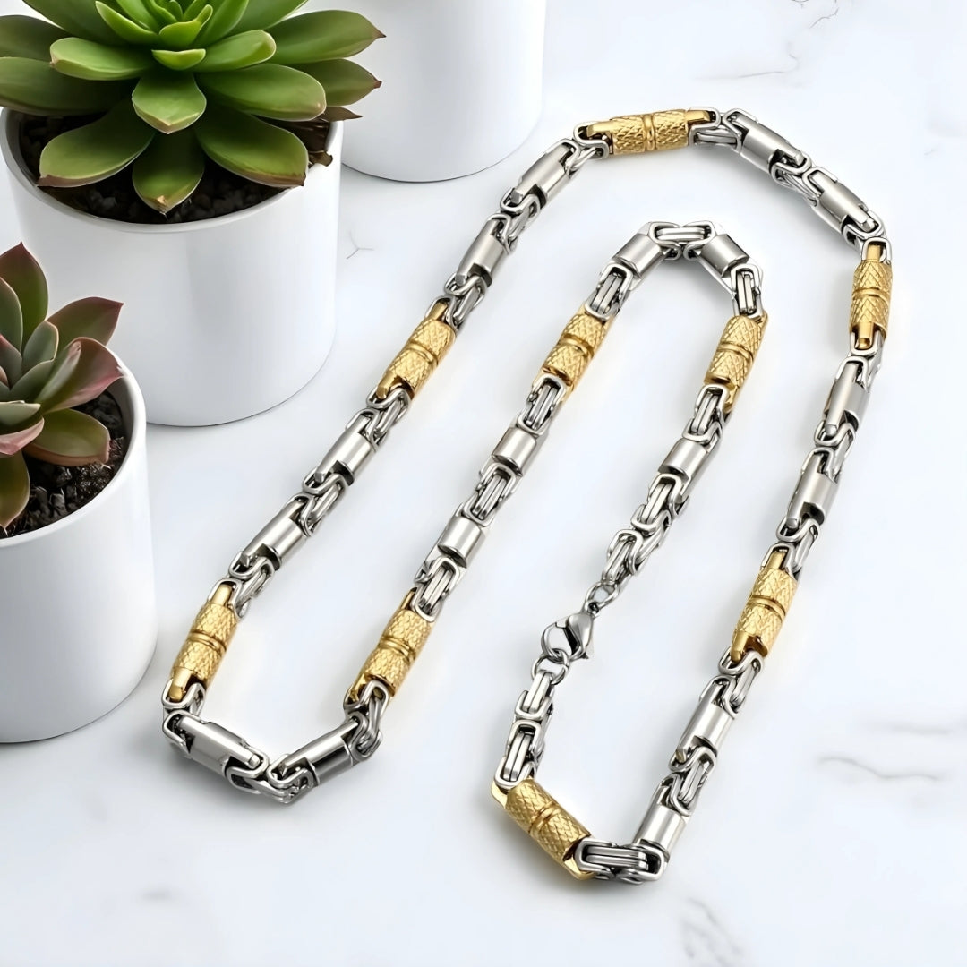 Chaine homme byzantine RLX argent dore presentation table marbre plantes succulentes
