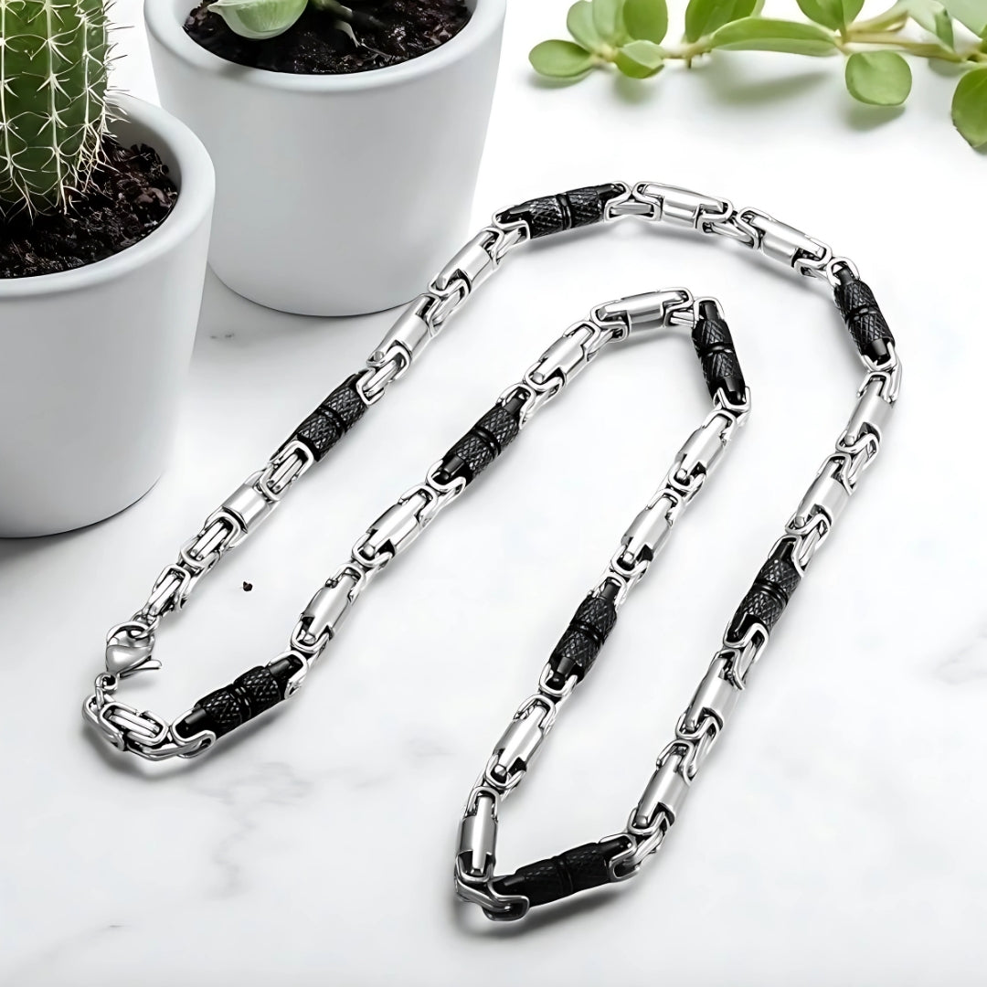 Chaine homme byzantine RLX argent noir presentation table marbre plantes succulentes