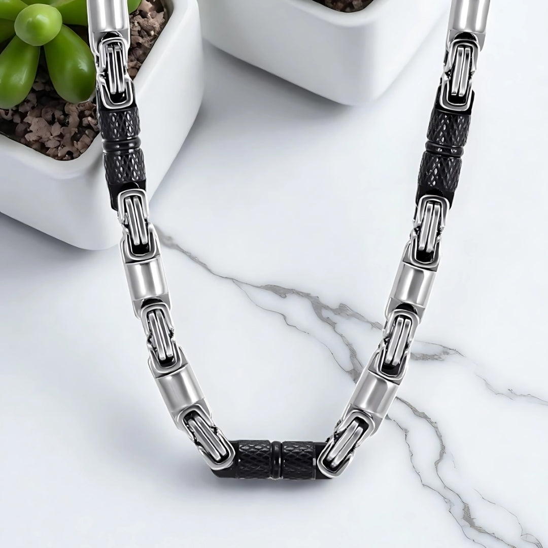 Chaine homme byzantine RLX variante argent noir presentation table marbre plantes succulentes