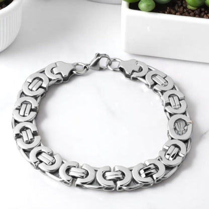 Bracelet homme BYZANTIN EMPEREUR ARRONDI™ argent table blanche plante