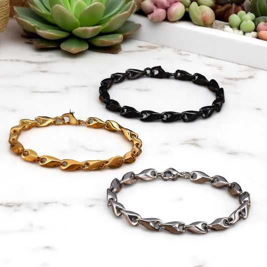 Bracelet homme WAVE LINKS™ trois variantes doree noire argent table marbre