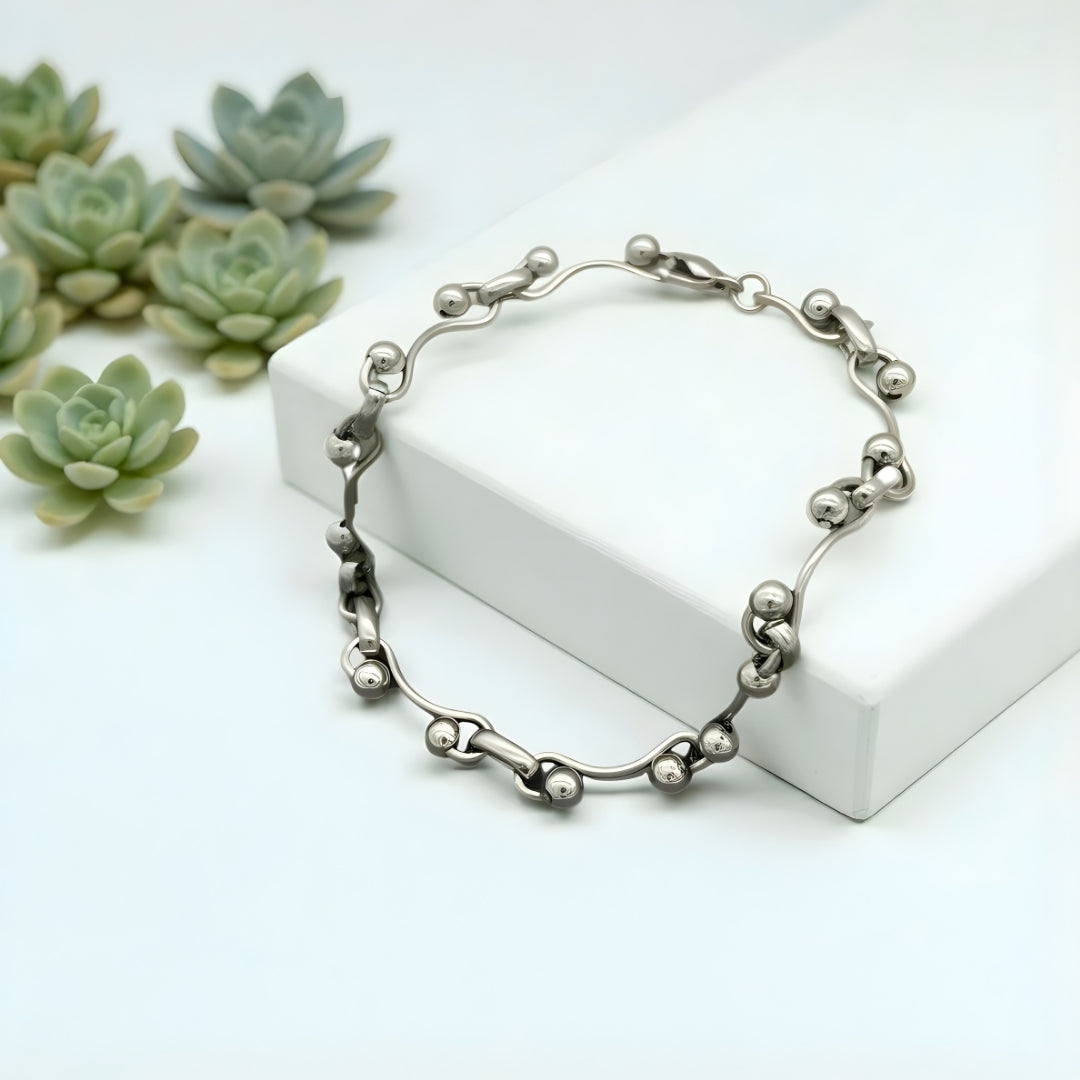 Bracelet homme billes ondulées WAVELINK presentation plantes marbre