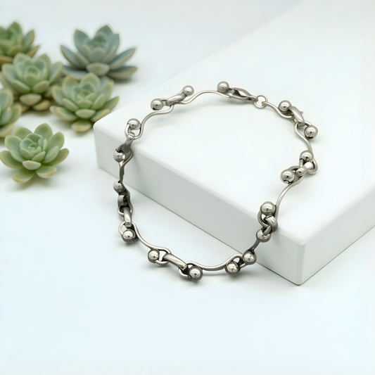 Bracelet homme billes ondulées WAVELINK presentation plantes marbre