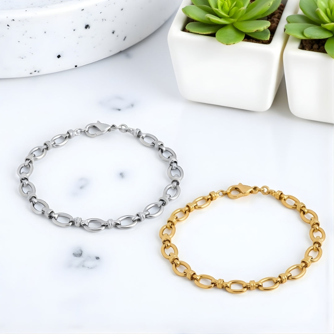 Bracelet homme maillons ovales dore argent poignet presentation marbre plantes
