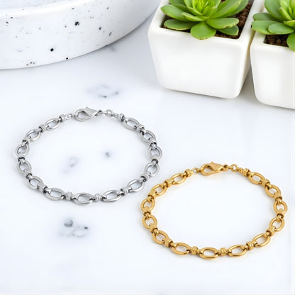 Bracelet homme maillons ovales dore argent poignet presentation marbre plantes