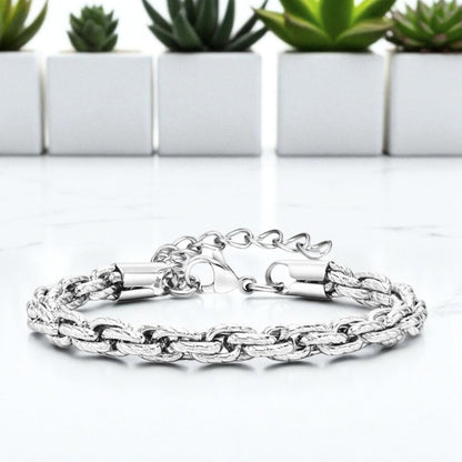 Bracelet homme motifs serpent argent table blanche plantes presentation