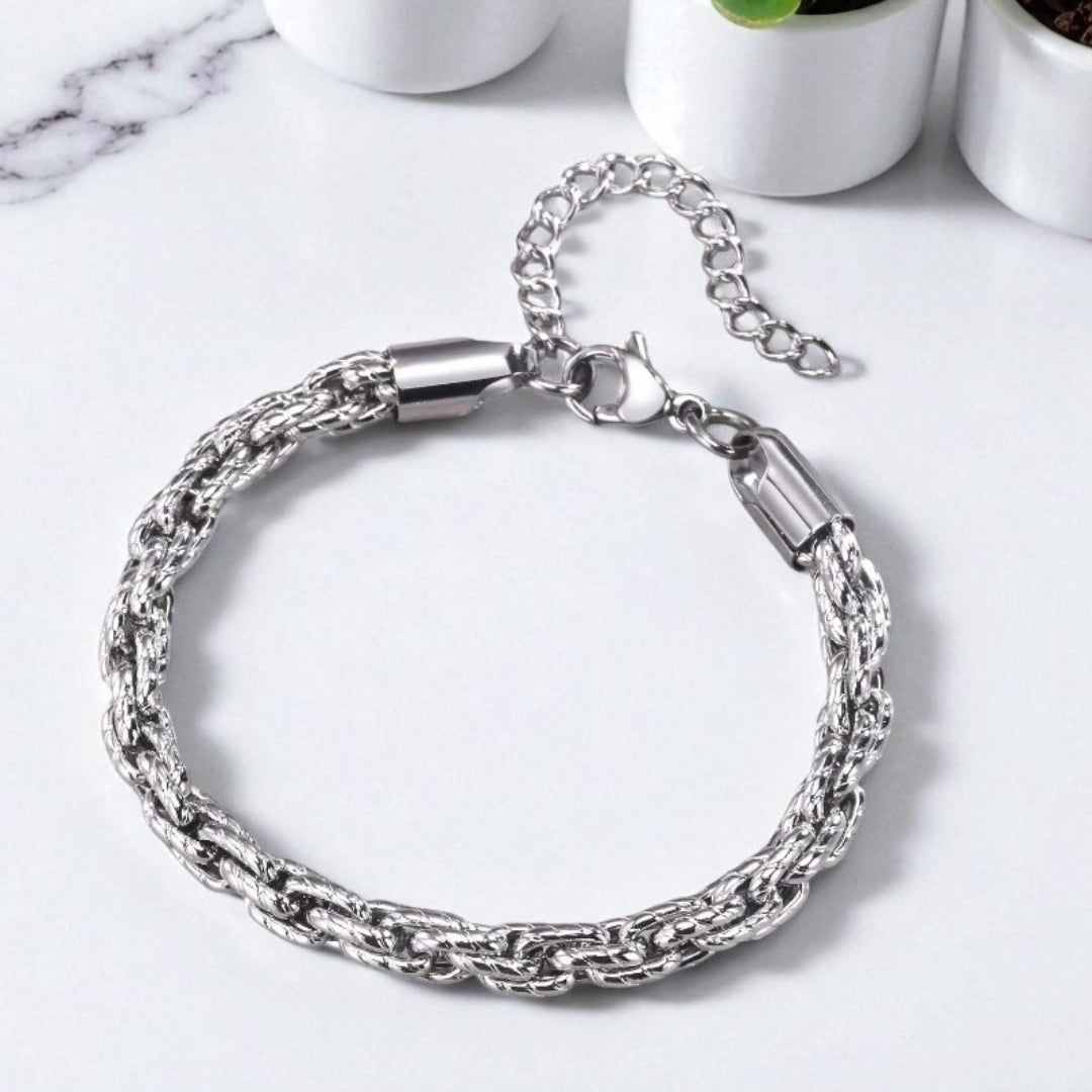 Bracelet homme motifs serpent argent table blanche plantes presentation dessus