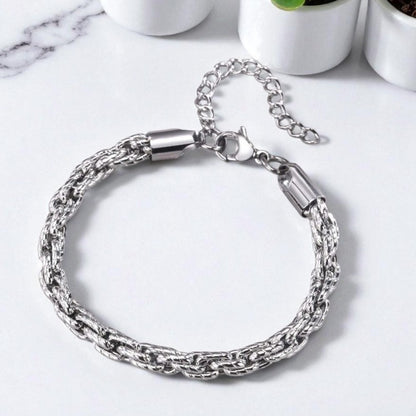 Bracelet homme motifs serpent argent table blanche plantes presentation dessus