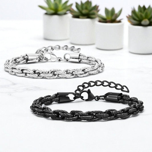 Bracelet homme motifs serpent noir argent table blanche plantes presentation