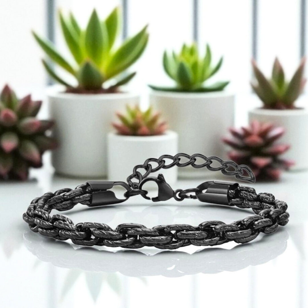 Bracelet homme motifs serpent noir table blanche plantes presentation