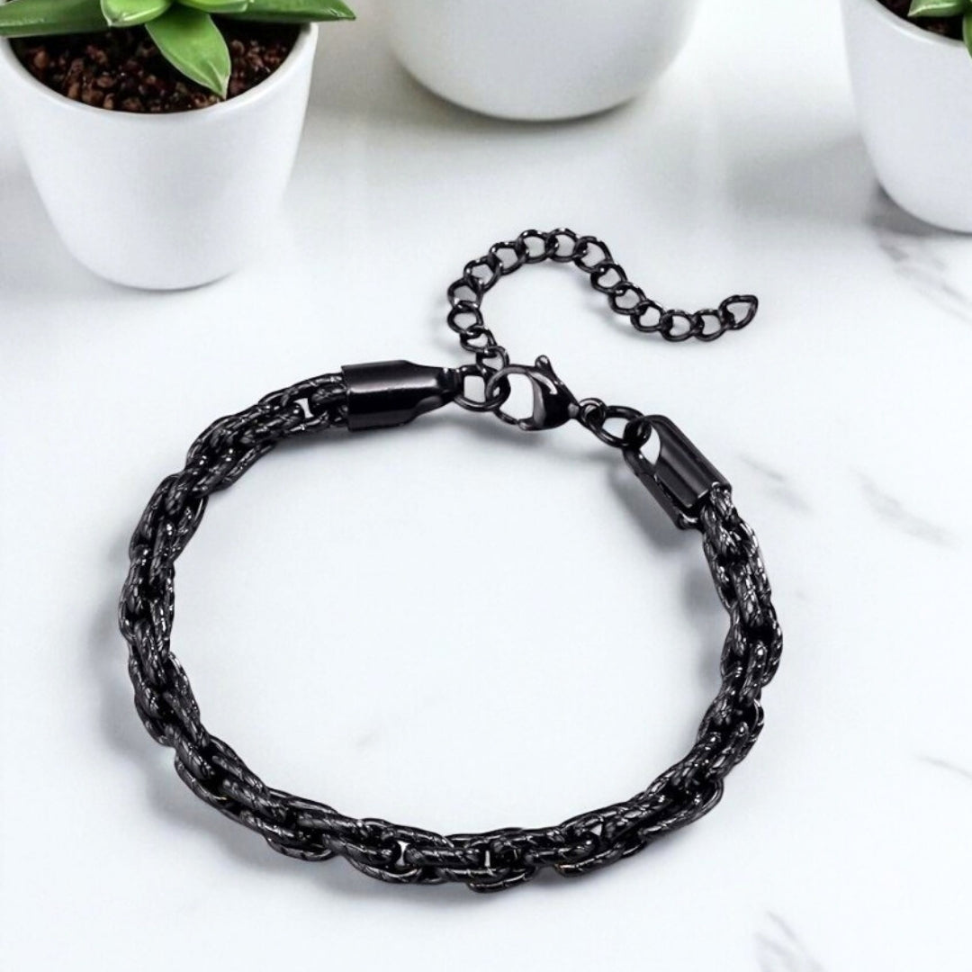 Bracelet homme motifs serpent noir table blanche plantes presentation dessus