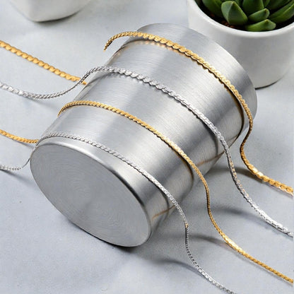 CHAINE HOMME SINGAPOUR DORÉ ARGENT PRESENTATION CYLINDRE ARGENT PLANTES