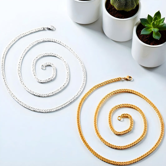 Chaîne homme, Collier à anneaux serrés argent dore presentation plantes table blanche