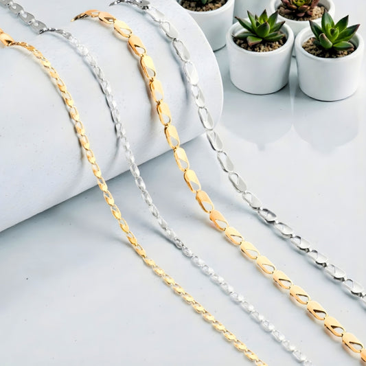 Chaine homme Maillons Paperclip argente doree table blanche deux grandeur