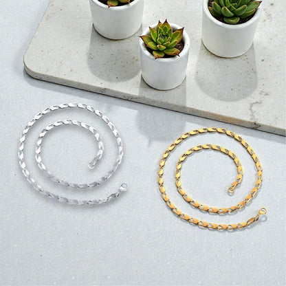 Chaine homme Maillons Paperclip argente doree table blanche deux longueur