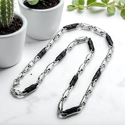 Chaine homme byzantine RLX argent noir  presentation table marbre plantes succulentes