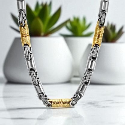 Chaine homme byzantine RLX variante argent dore presentation table marbre plantes succulentes