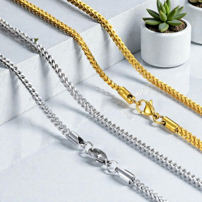Chaine homme tressee maille Franco 3mm dore argent fermoir table marbre