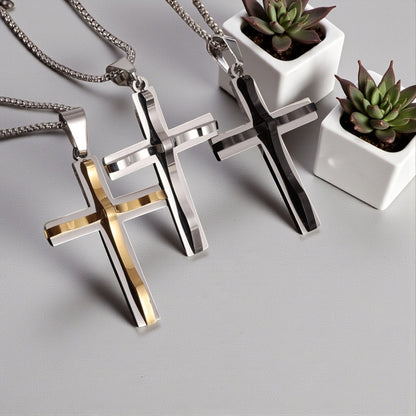 Collier homme, pendentif croix RAISED CROSS™ variantes doree argentee noire table blanche