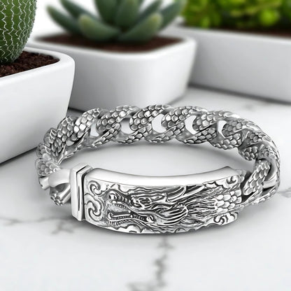 bracelet homme dragon head argent plantes table marbre presentation